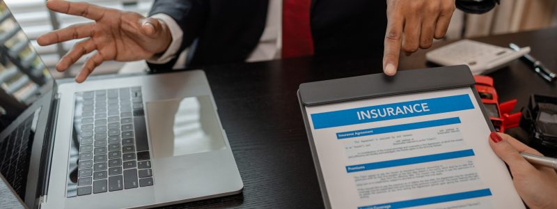 a lawyer explains the details of a car insurance policy and all the costs to a client, a lawyer explains to a client what will happen if she dose not have car insurance